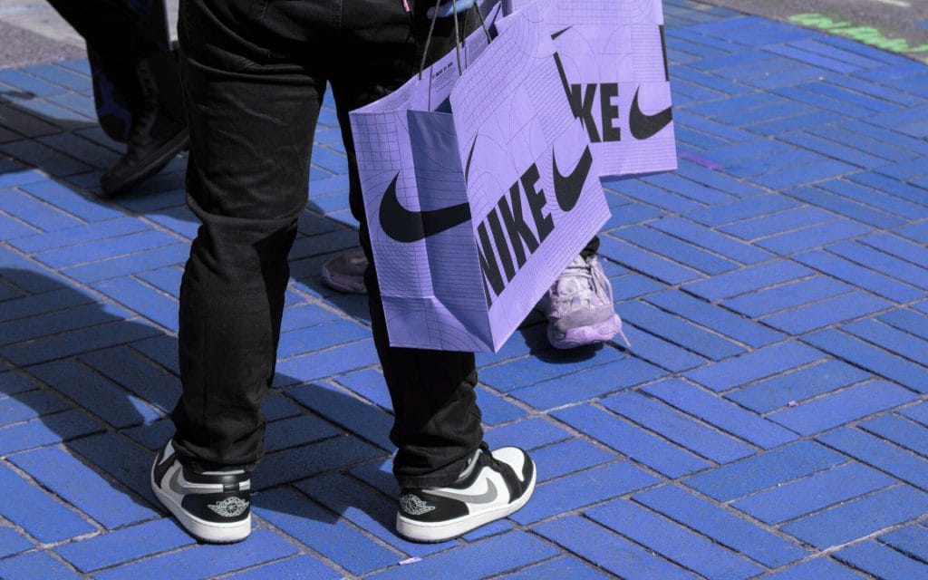 Brand Messaging Made Simple-Nike fans who have just purchased new release sneakers from Nike's Flagship Store in downtown Portland, Oregon, are seen on the streets with their nike shopping bags.