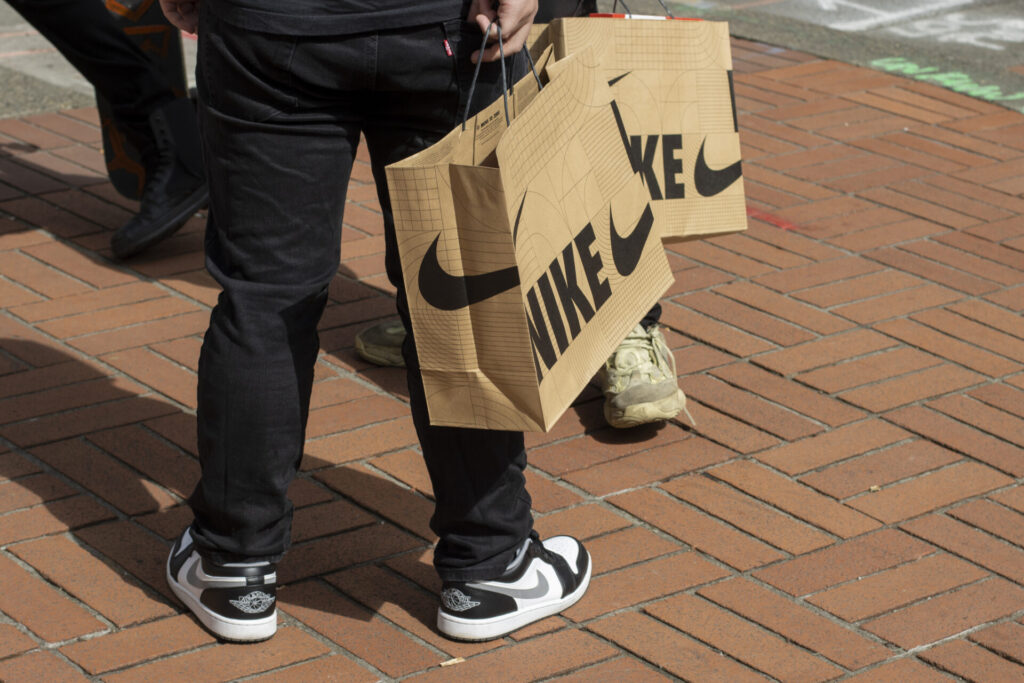 iStock 1391545555 Brand Messaging Made Simple-Nike fans who have just purchased new release sneakers from Nike's Flagship Store in downtown Portland, Oregon, are seen on the streets with their nike shopping bags.